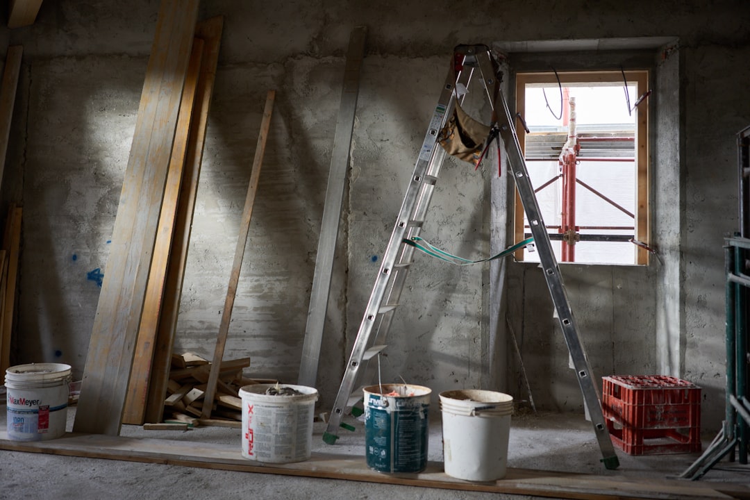 a-ladder-and-buckets-of-paint-in-a-room-under-construction-xxanshmt5so